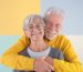 happy-caucasian-beautiful-senior-couple-standing-isolated-colorful-background-hugging-with-love-elderly-whitehaired-people-smiling-carefree-enjoying-retirement-good-company-free-time